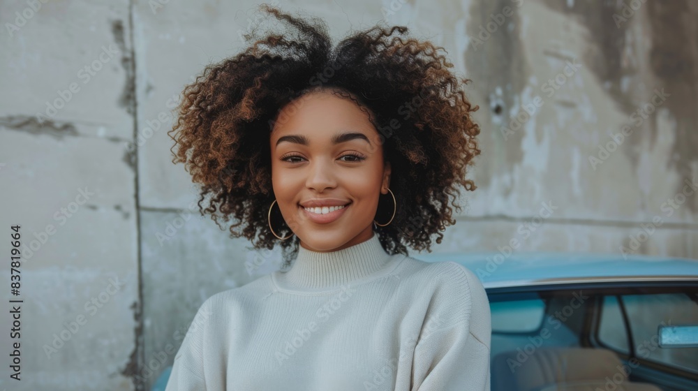 A plus size woman with curly hair standing confidently next to a blue car A plus size woman with curly hair standing confidently next to a blue car