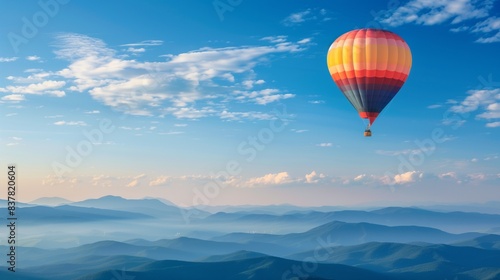 Hot Air Balloon Floating in Clear Sky with Mountains