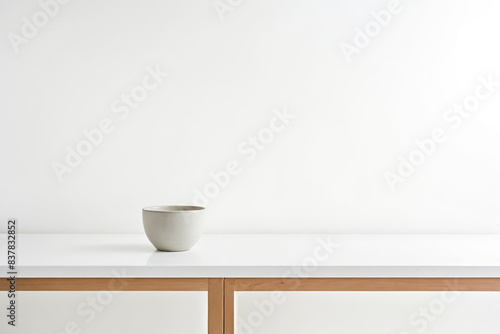 Simple White Mug on White Table Top © Rysak