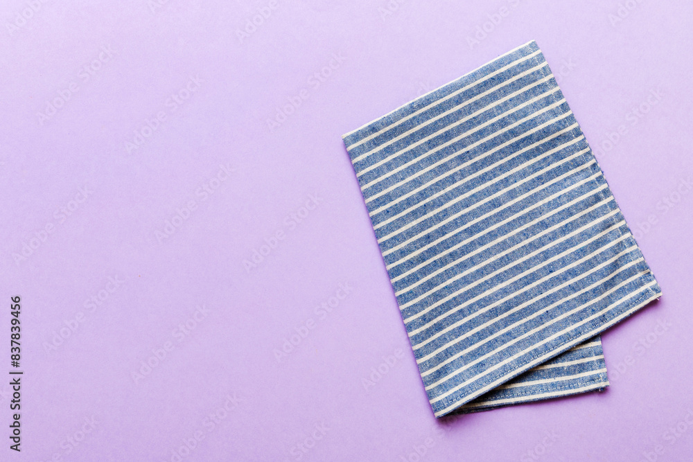 top view with blue kitchen napkin isolated on table background. Folded cloth for mockup with copy space, Flat lay. Minimal style top view with blue kitchen napkin isolated on table background. Folded cloth for mockup with copy space, Flat lay. Minimal style