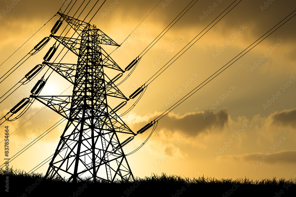 Silhouette of High Voltage Power Lines and Transmission Tower at Sunset ...