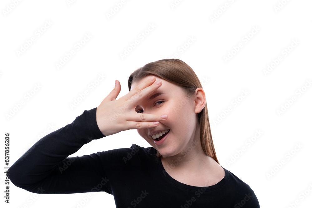 Portrait of a smiling funny schoolgirl with brown hair on a white background Portrait of a smiling funny schoolgirl with brown hair on a white background