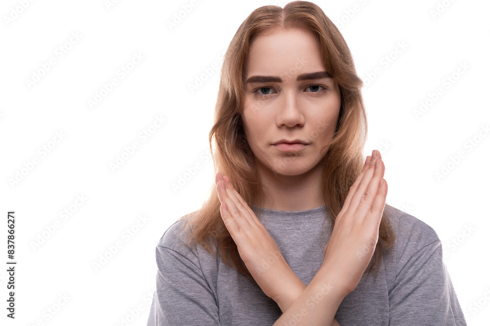 Headshot portrait of a teenage girl with crossed arms Headshot portrait of a teenage girl with crossed arms