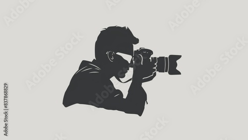 logo about photography where the subject is the digital camera and a silhoutte of a man photo