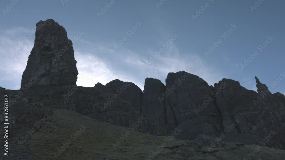 Slow panning shot of the beautiful rock formations at the Old Man of Storr Slow panning shot of the beautiful rock formations at the Old Man of Storr