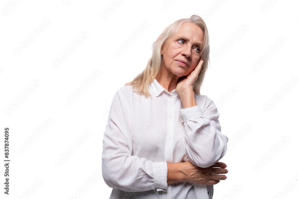 65 year old tired European mature woman wearing shirt on white background 65 year old tired European mature woman wearing shirt on white background