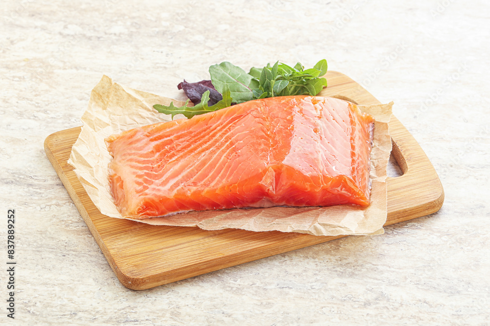Raw salmon fillet over board Raw salmon fillet over board