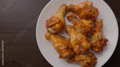 roasted spicy chicken wing in a white plate 