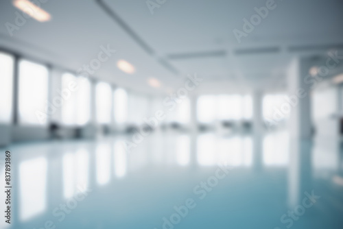 Blurred modern office interior, empty corporate workspace, blue tinted business environment, abstract professional setting, unfocused workplace, versatile design concept