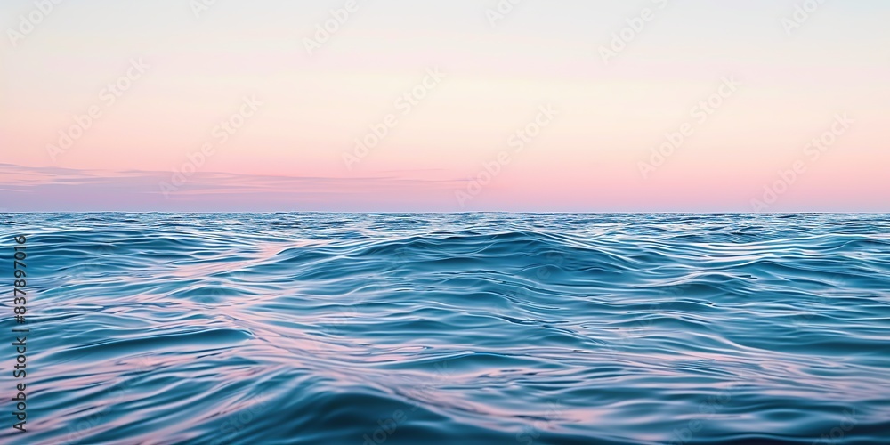 Obraz premium Beautiful ocean with a pink and blue sky background