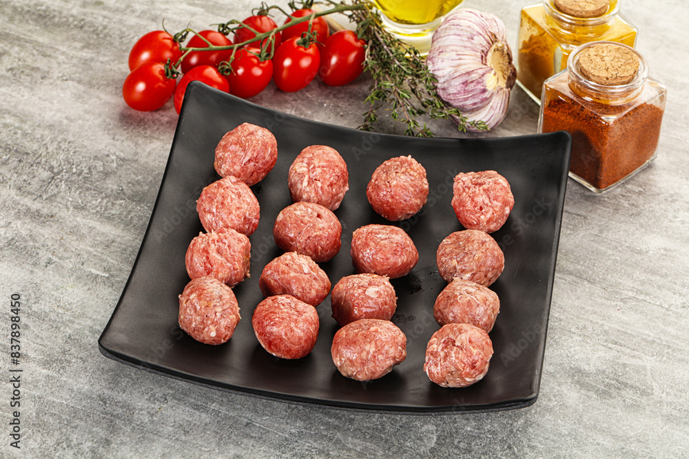 Uncooked raw beef meatball minced Uncooked raw beef meatball minced