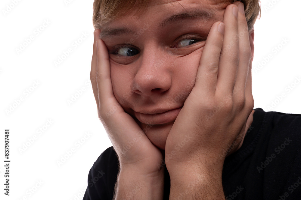 Portrait of a teenage guy with blond hair having problems Portrait of a teenage guy with blond hair having problems