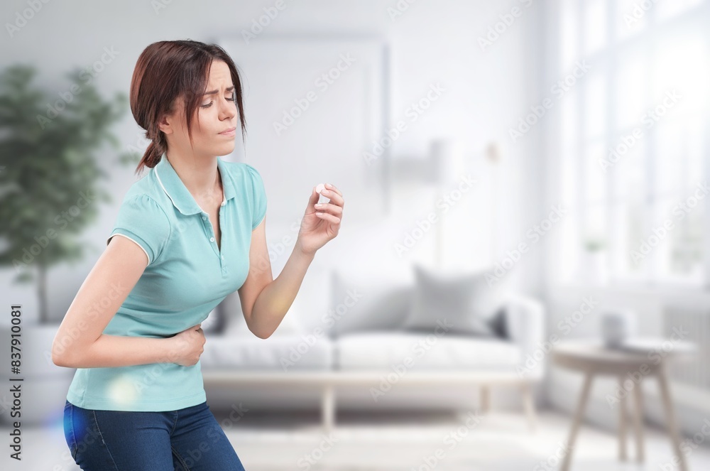 Unhappy sick young woman suffering from pain Unhappy sick young woman suffering from pain