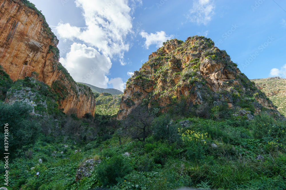 Obraz premium Mountain landscape with rock formations at the Zingaro Nature Reserve at the mediterranean sea, San Vito Lo Capo, Sicily, Italy