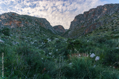 Mountain landscape with rock formations at the Zingaro Nature Reserve at the mediterranean sea, San Vito Lo Capo, Sicily, Italy photo