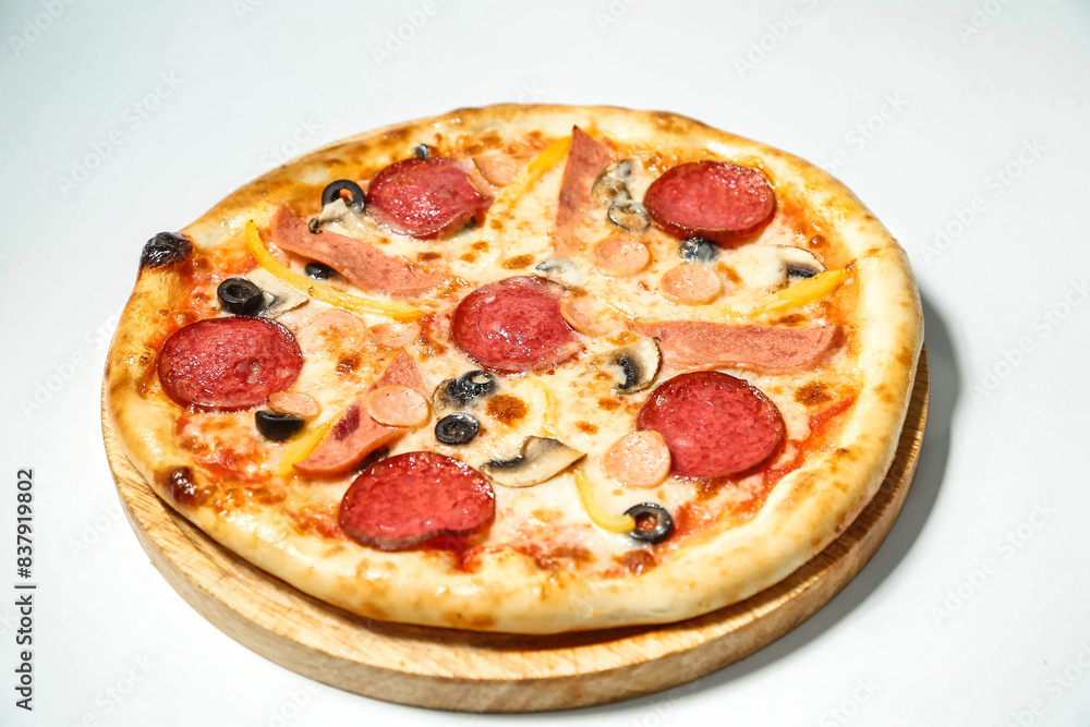 Pepperoni and Black Olive Pizza on White Surface Pepperoni and Black Olive Pizza on White Surface