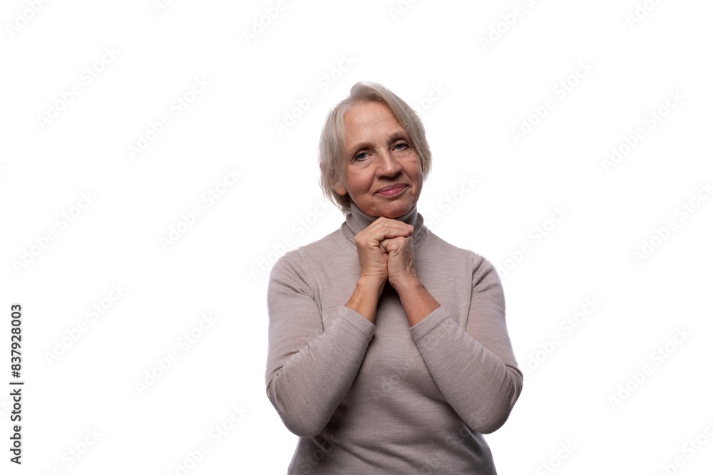 European senior woman with gray hair showing modesty on white background European senior woman with gray hair showing modesty on white background