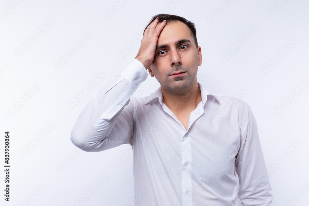 A 40-year-old brunette man dressed in a white shirt is excited about business tasks A 40-year-old brunette man dressed in a white shirt is excited about business tasks