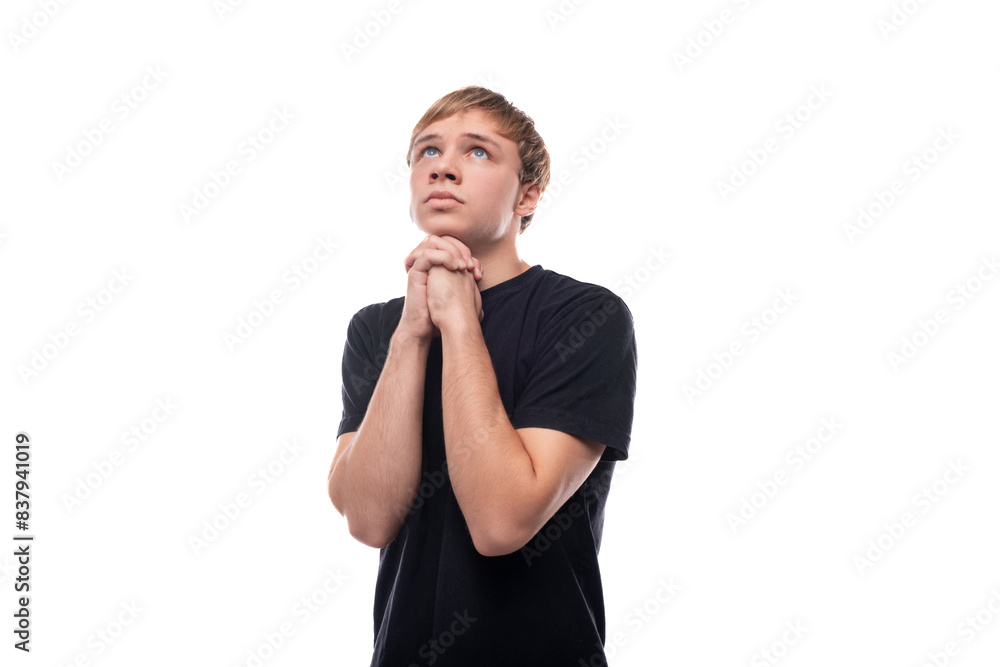 Smart Caucasian blond guy 16 years old dressed in a black T-shirt Smart Caucasian blond guy 16 years old dressed in a black T-shirt