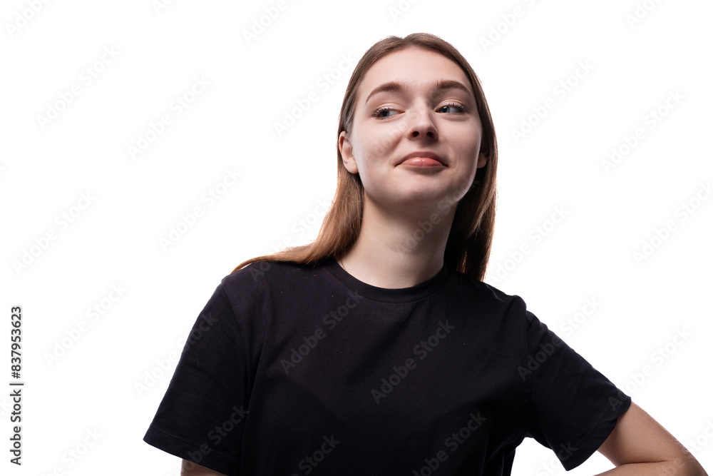 A 15 year old girl with brown hair is wearing a black basic T-shirt A 15 year old girl with brown hair is wearing a black basic T-shirt