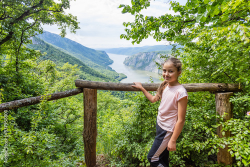  Happy Child At The Breathtaking View Of The Danube River Gorge. Surrounded By Lush Greenery, The Beauty Of Nature 