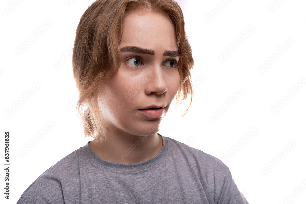 Charismatic teenage schoolgirl with brown hair and braces with surprise on her face Charismatic teenage schoolgirl with brown hair and braces with surprise on her face