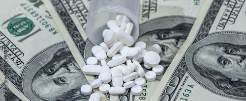 drugs or medicine pills above hundred dollars bill