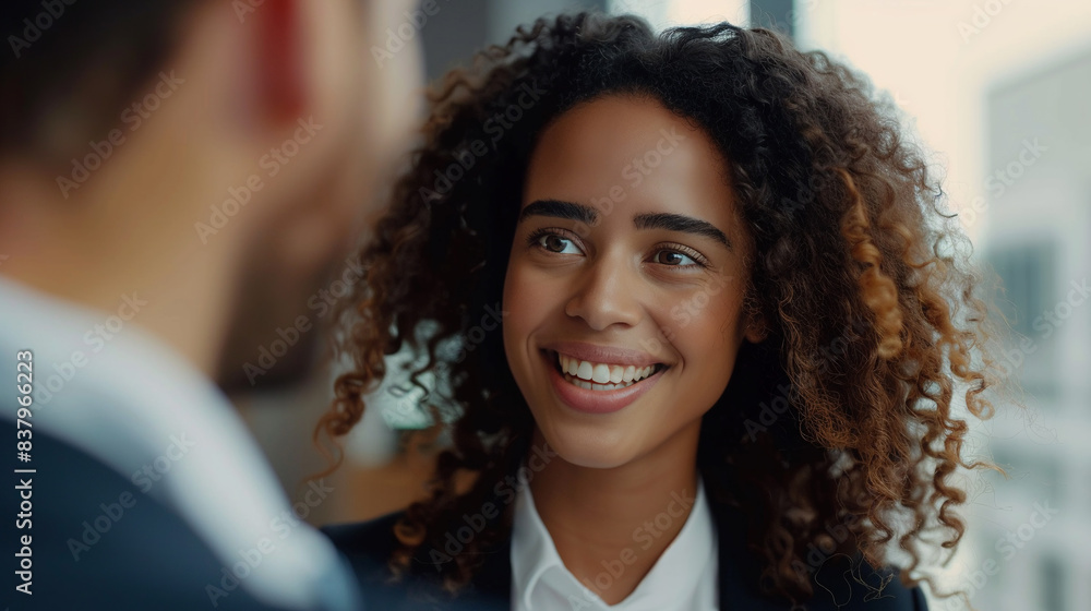 Businesswoman is consulting her colleague about work on new project sitting in modern office. Businesswoman is consulting her colleague about work on new project sitting in modern office.