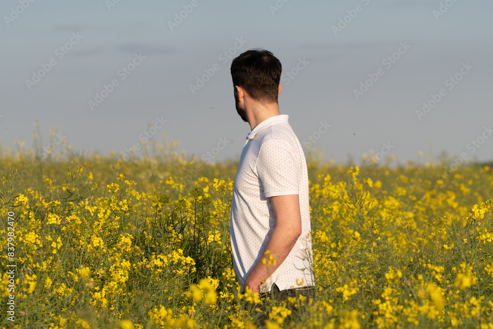 Fototapeta premium Joyful Summer: A Happy Child with Chaplet in a Blooming Meadow