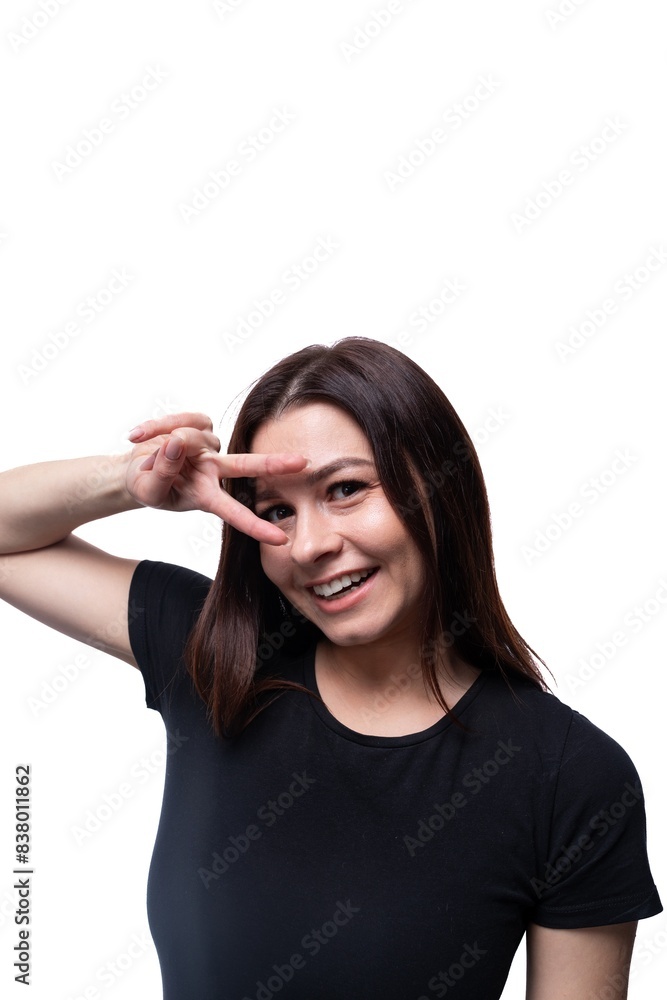 Young friendly woman smiling at the camera against a background of copy space Young friendly woman smiling at the camera against a background of copy space
