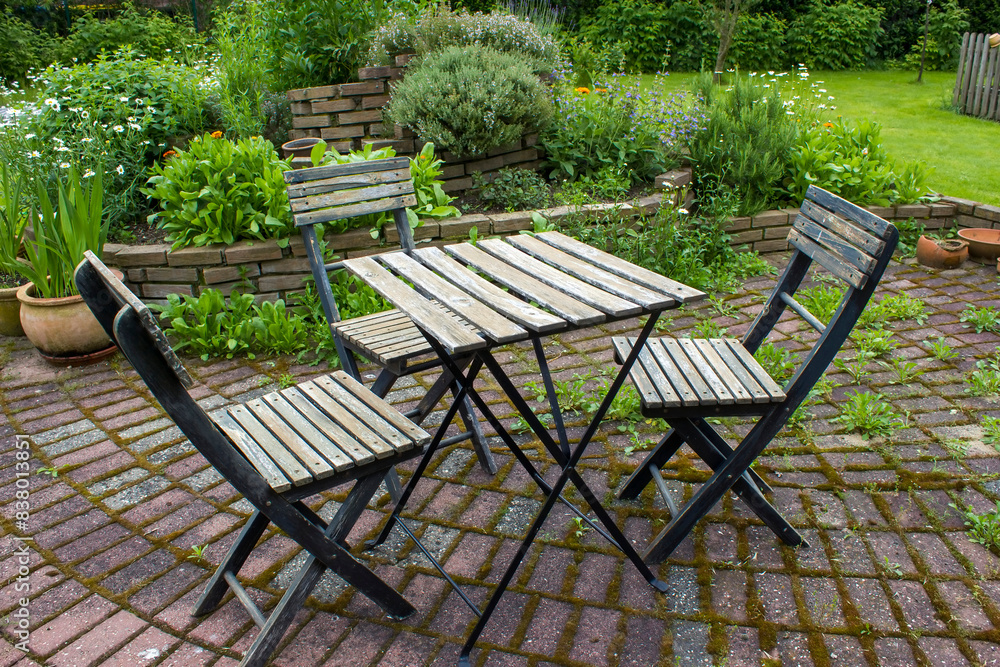 herb spiral in the garden and table with chairs herb spiral in the garden and table with chairs