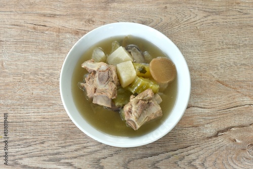 boiled slice radish and bitter cucumber with chop pork bone soup on bowl 