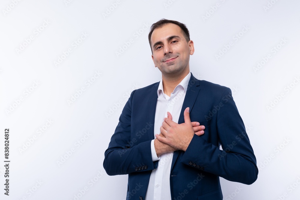 A 40-year-old successful brunette man dressed in a blue jacket is proud of himself A 40-year-old successful brunette man dressed in a blue jacket is proud of himself