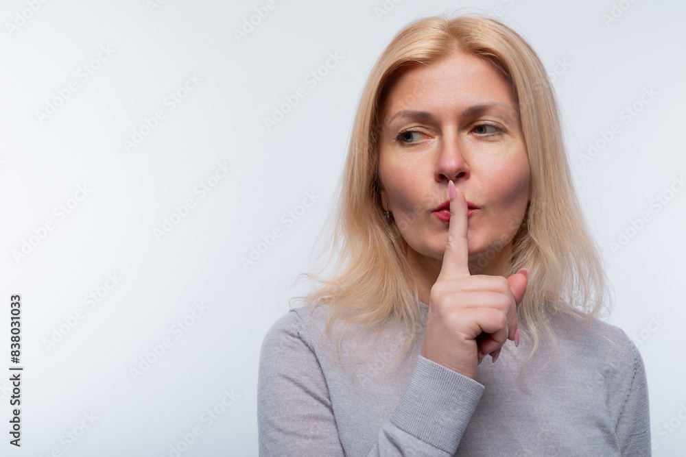 European woman with blonde hair keeps a secret European woman with blonde hair keeps a secret