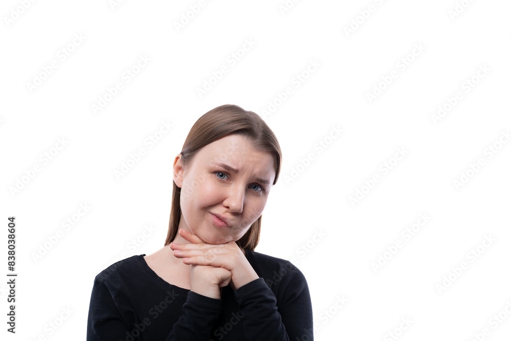 Close-up portrait of a cunning fair-haired 12 year old girl on a white background Close-up portrait of a cunning fair-haired 12 year old girl on a white background