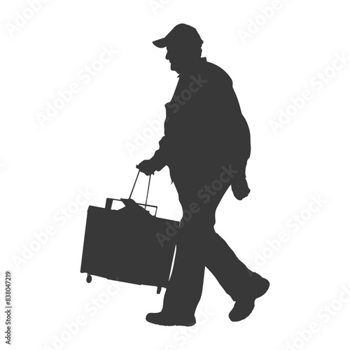 Silhouetted traveler, cap, pulling wheeled luggage, man on the move, isolated white background.