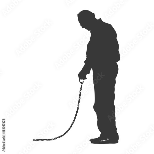 Silhouette of a man looking down at a chain on the ground, isolated.