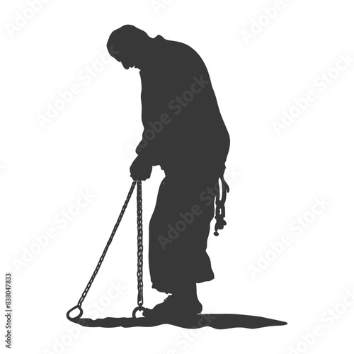 Silhouette of Buddhist Monk in Chain Dragging a Heavy Iron Ring.