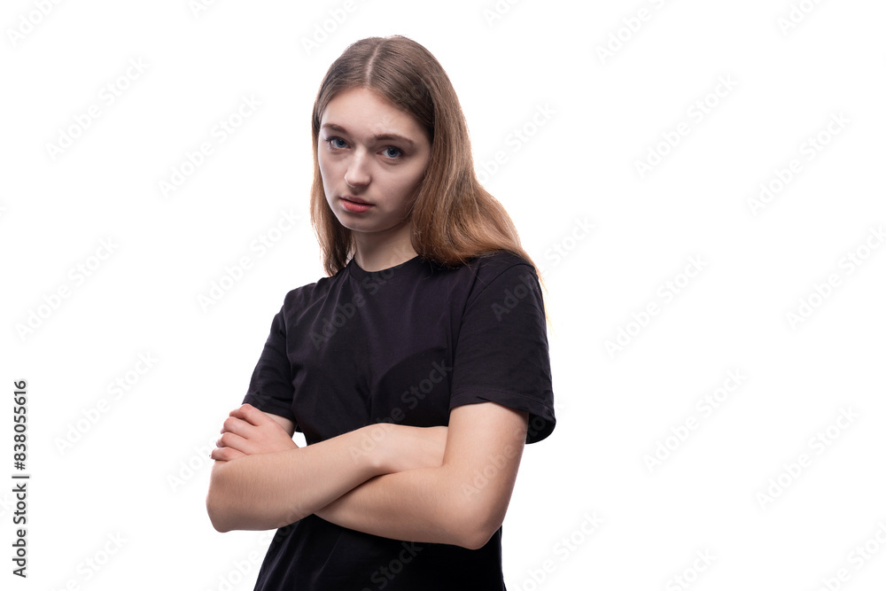 A cute fair-haired teenage girl in a black T-shirt is thinking A cute fair-haired teenage girl in a black T-shirt is thinking