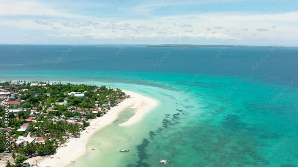 Aerial view of sandy beach with palm trees and sea surf with waves. Bantayan island, Philippines. Aerial view of sandy beach with palm trees and sea surf with waves. Bantayan island, Philippines.