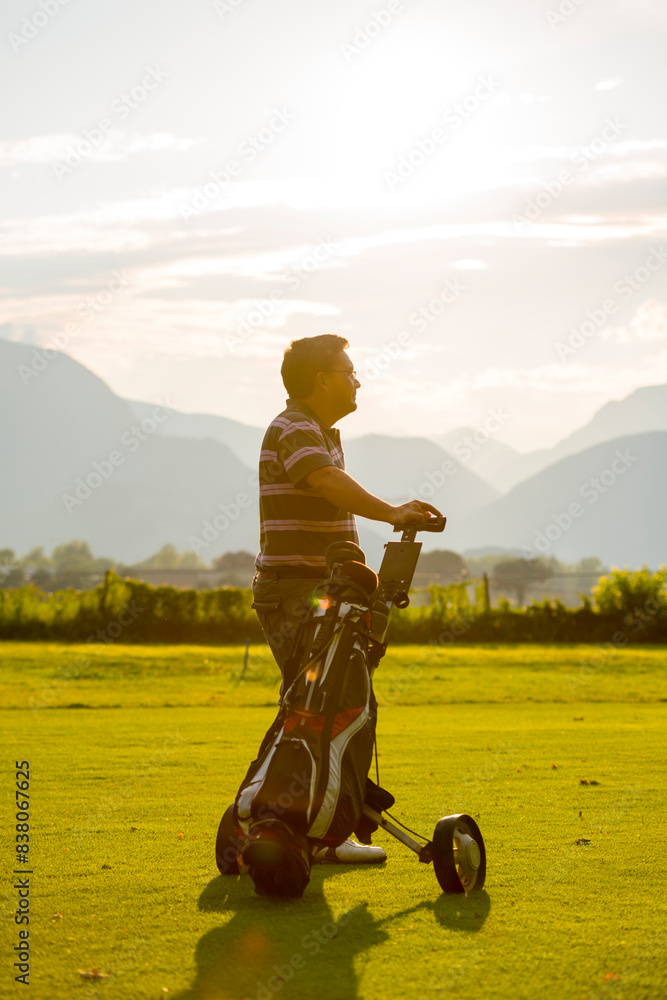custom made wallpaper toronto digitalGolfer with His Golf Bag on the Fairway with Sunlight in Switzerland.