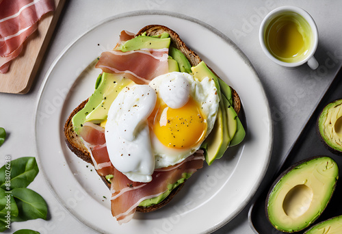 avocado toast with poached egg, cream cheese and jamon
