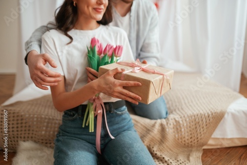 Conception of Valentine's day, embracing. Young couple are together at home