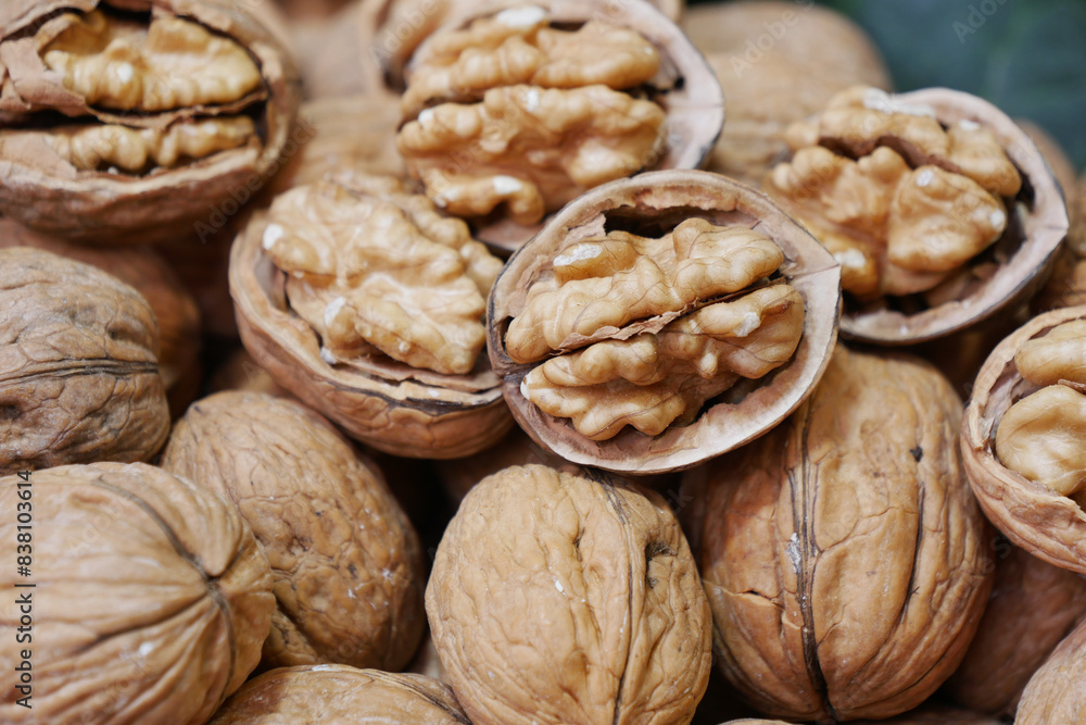 stack of natural walnuts selling at shop stack of natural walnuts selling at shop