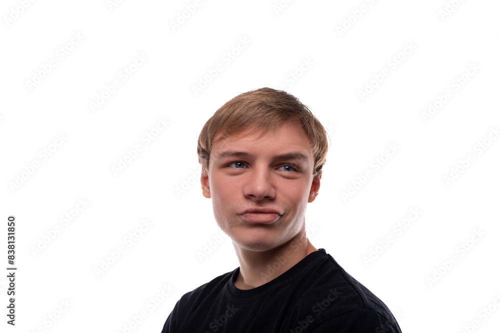 European blond teenager boy wearing a black T-shirt is proud of himself European blond teenager boy wearing a black T-shirt is proud of himself