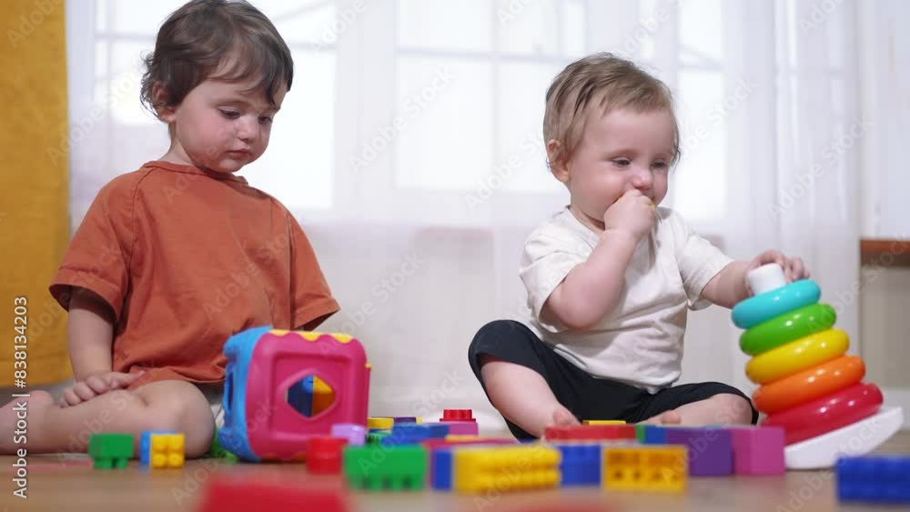 baby toddler group playing with toys. happy family a kid dream concept. baby toddler playing on the floor indoors with toys in lifestyle kindergarten. children group playing toys baby toddler group playing with toys. happy family a kid dream concept. baby toddler playing on the floor indoors with toys in lifestyle kindergarten. children group playing toys