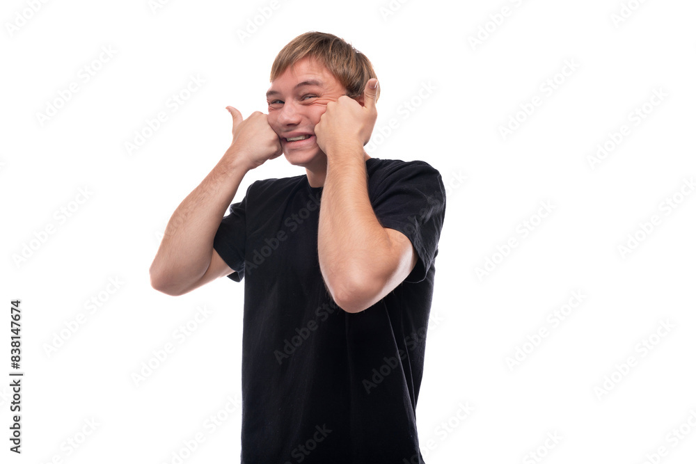 Fototapeta premium Portrait of an emotional teenage guy with brown hair