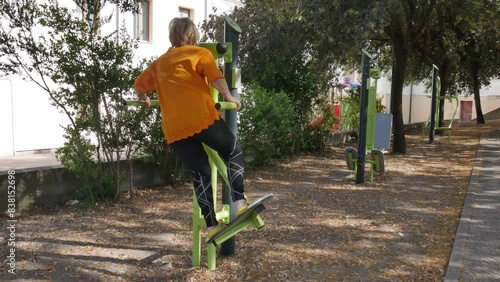 elderly outdoor sports. elderly people doing sports in an urban area equipped for sports, such as bicycles. keep seniors fit.