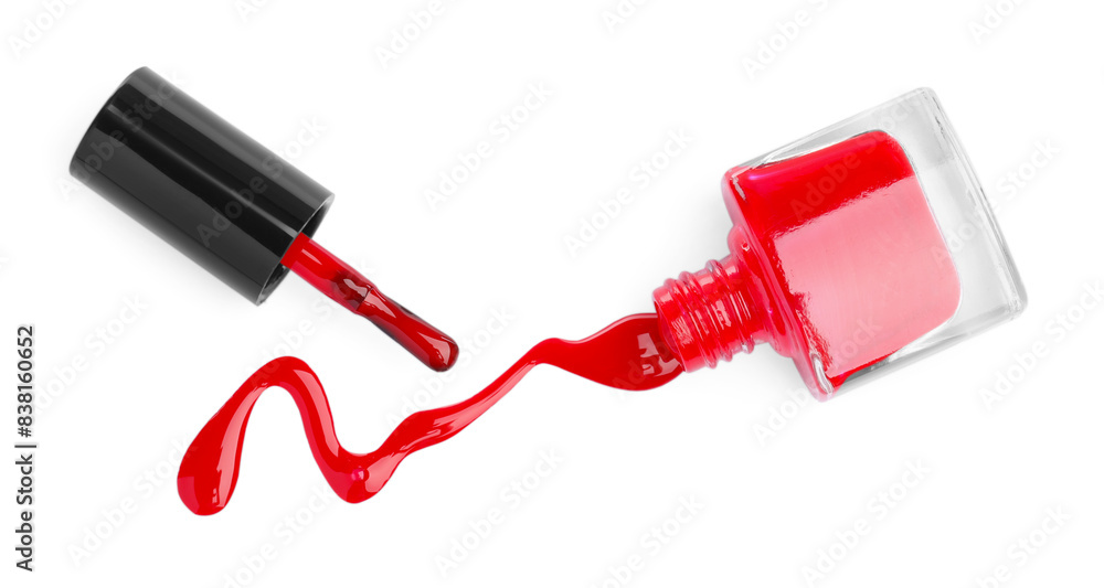 Overturned bottle of red nail polish and brush isolated on white, top view Overturned bottle of red nail polish and brush isolated on white, top view