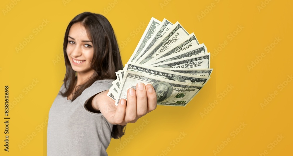 Young girl student hold cash money banknotes Young girl student hold cash money banknotes
